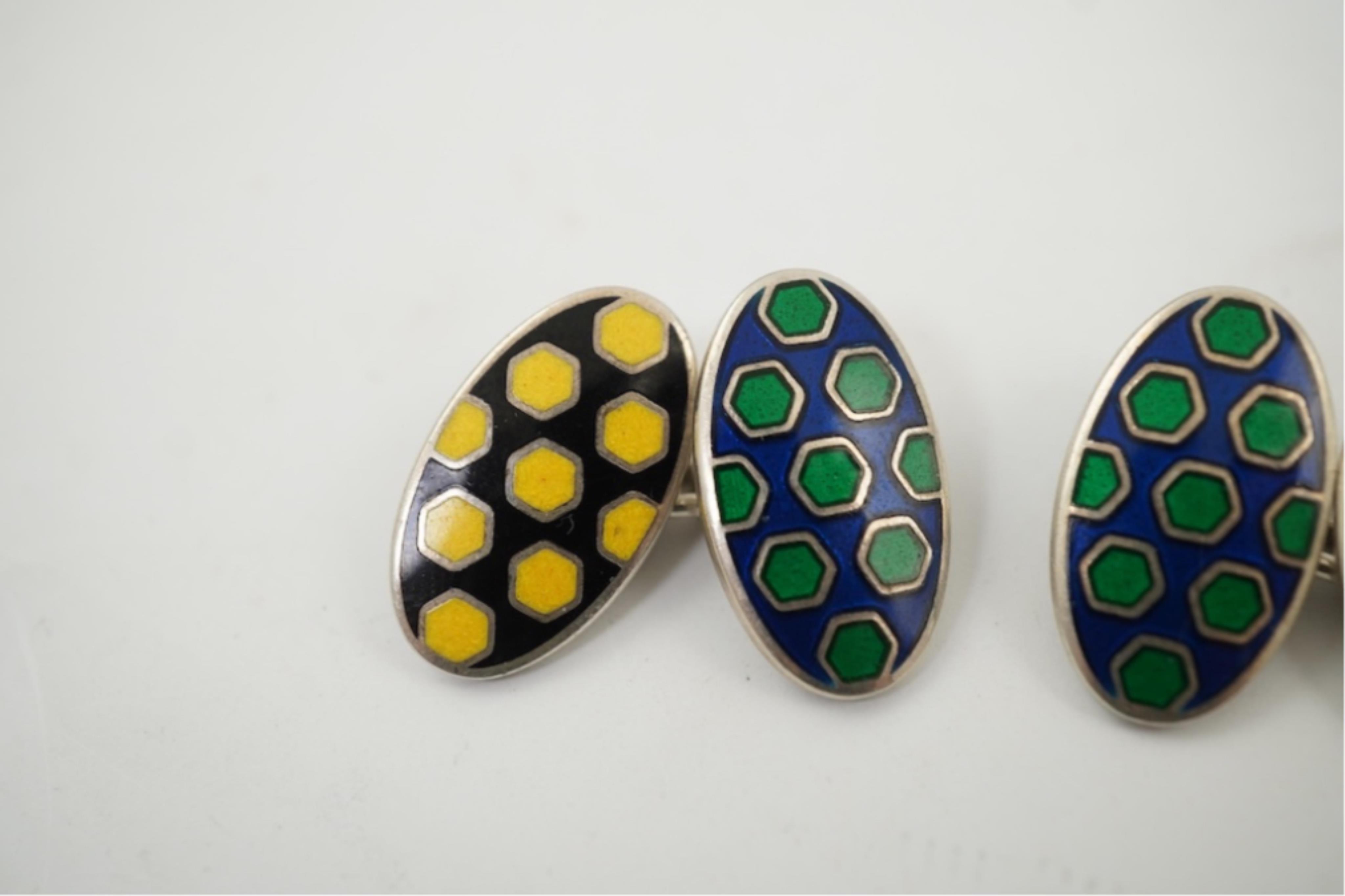 A modern pair of silver and polychrome enamel set oval cufflinks, 18mm.